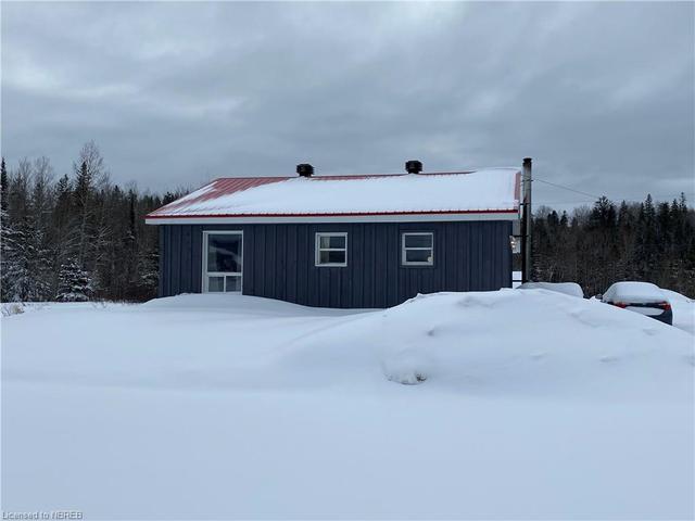 basement with wood stove | Image 12